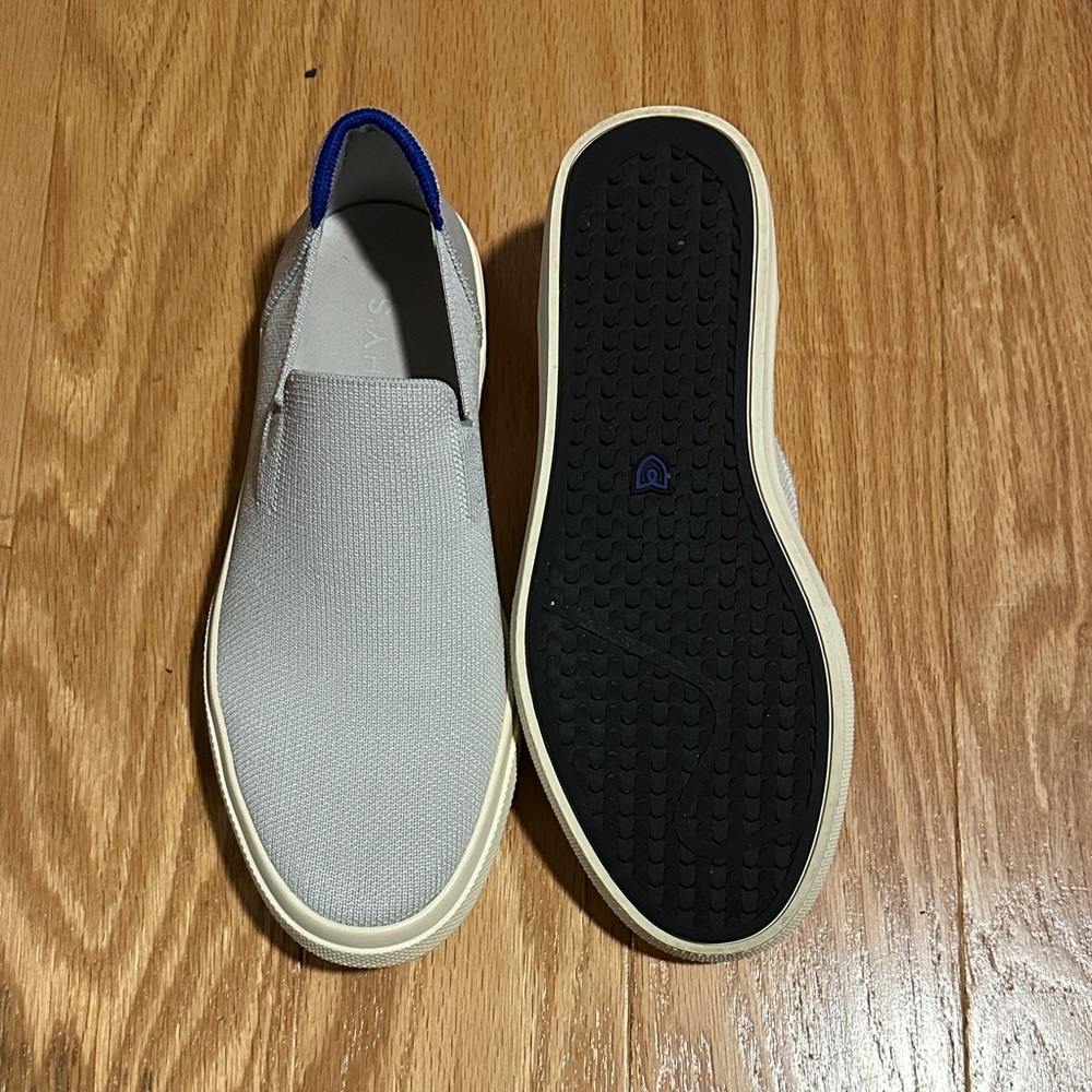 Rothy's Slip-On Sneakers in Light Gray with Blue Pull Tab